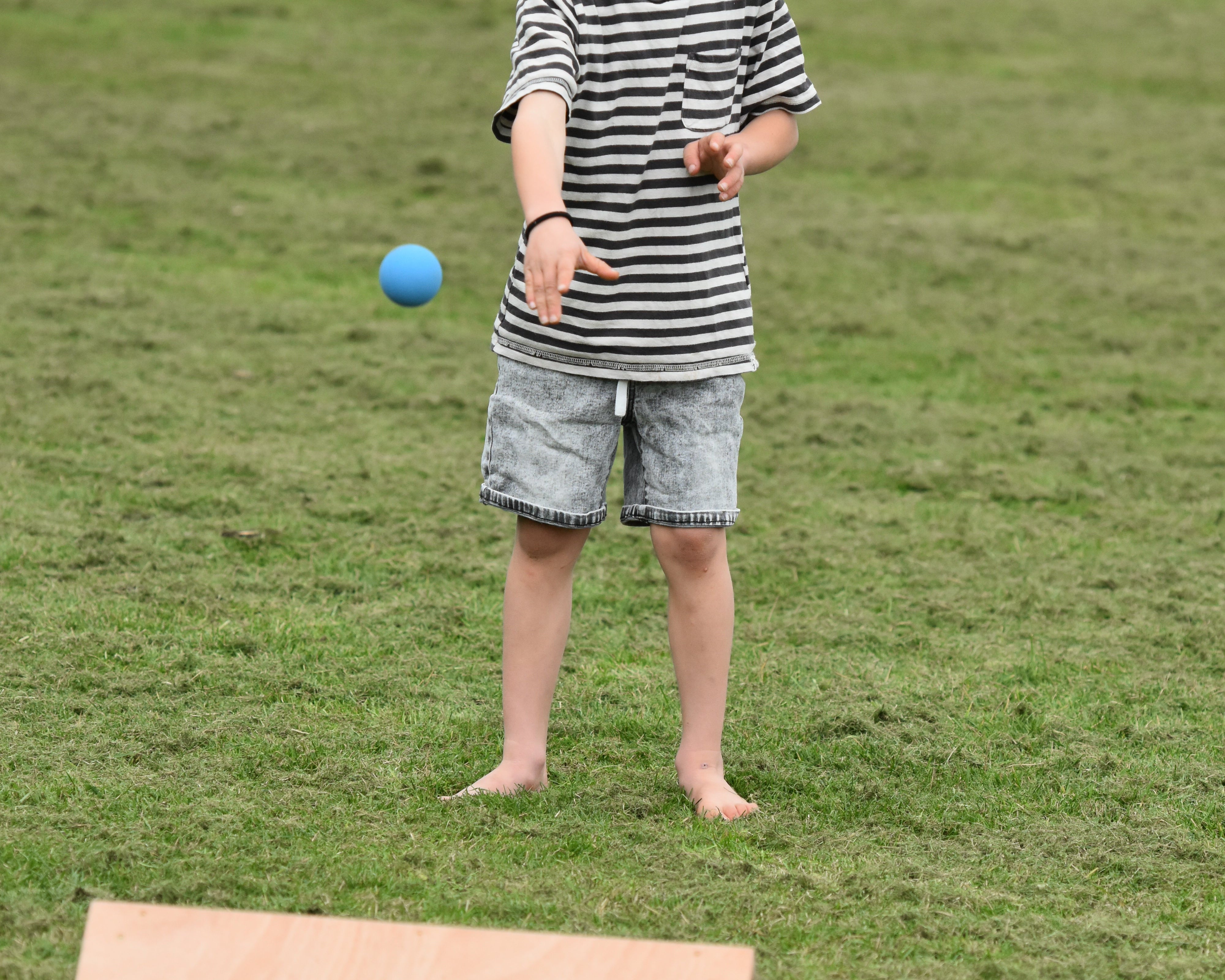 Kis playing outdoor games NZ — Gutter board in the backyard