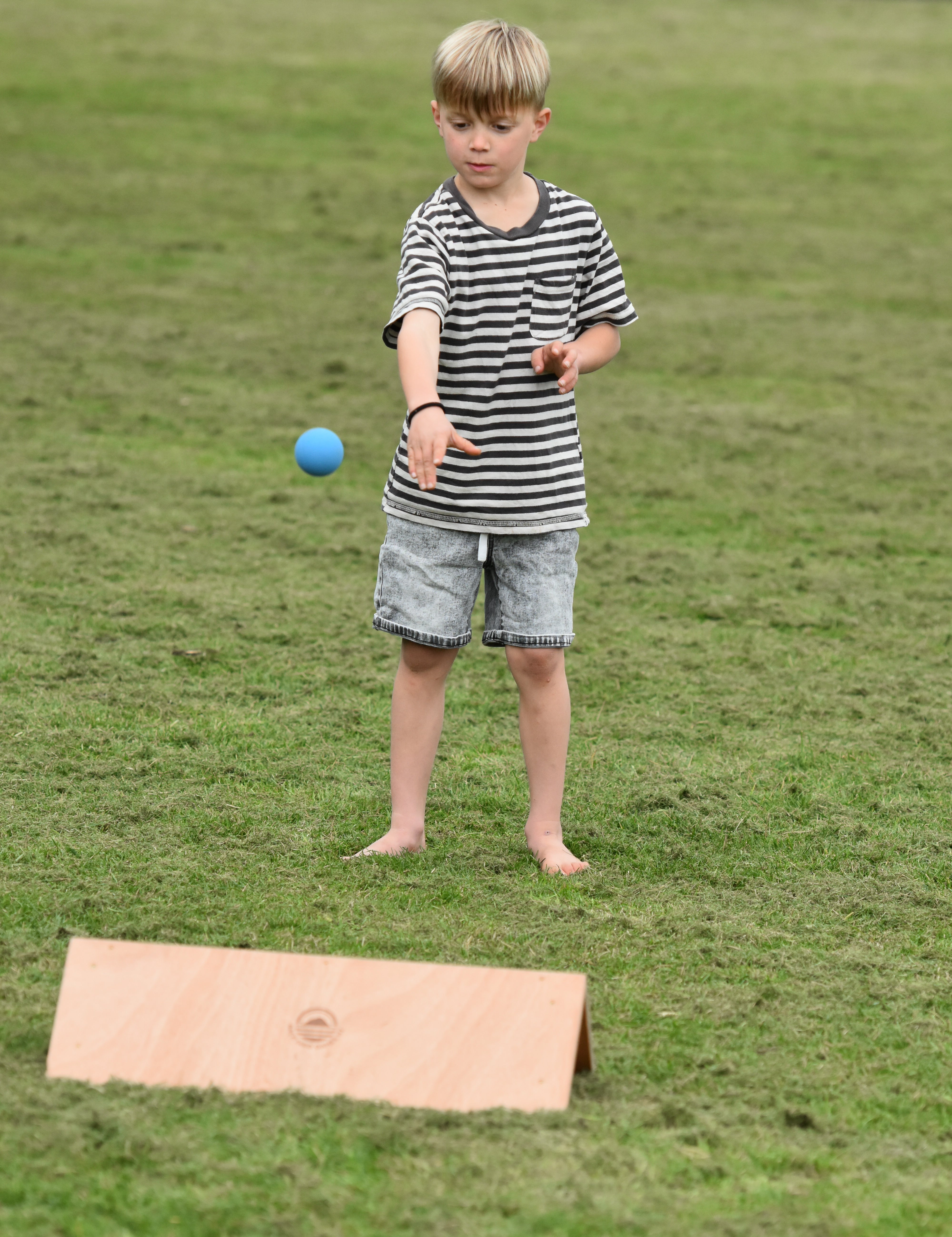 Kis playing outdoor games NZ — Gutter board in the backyard