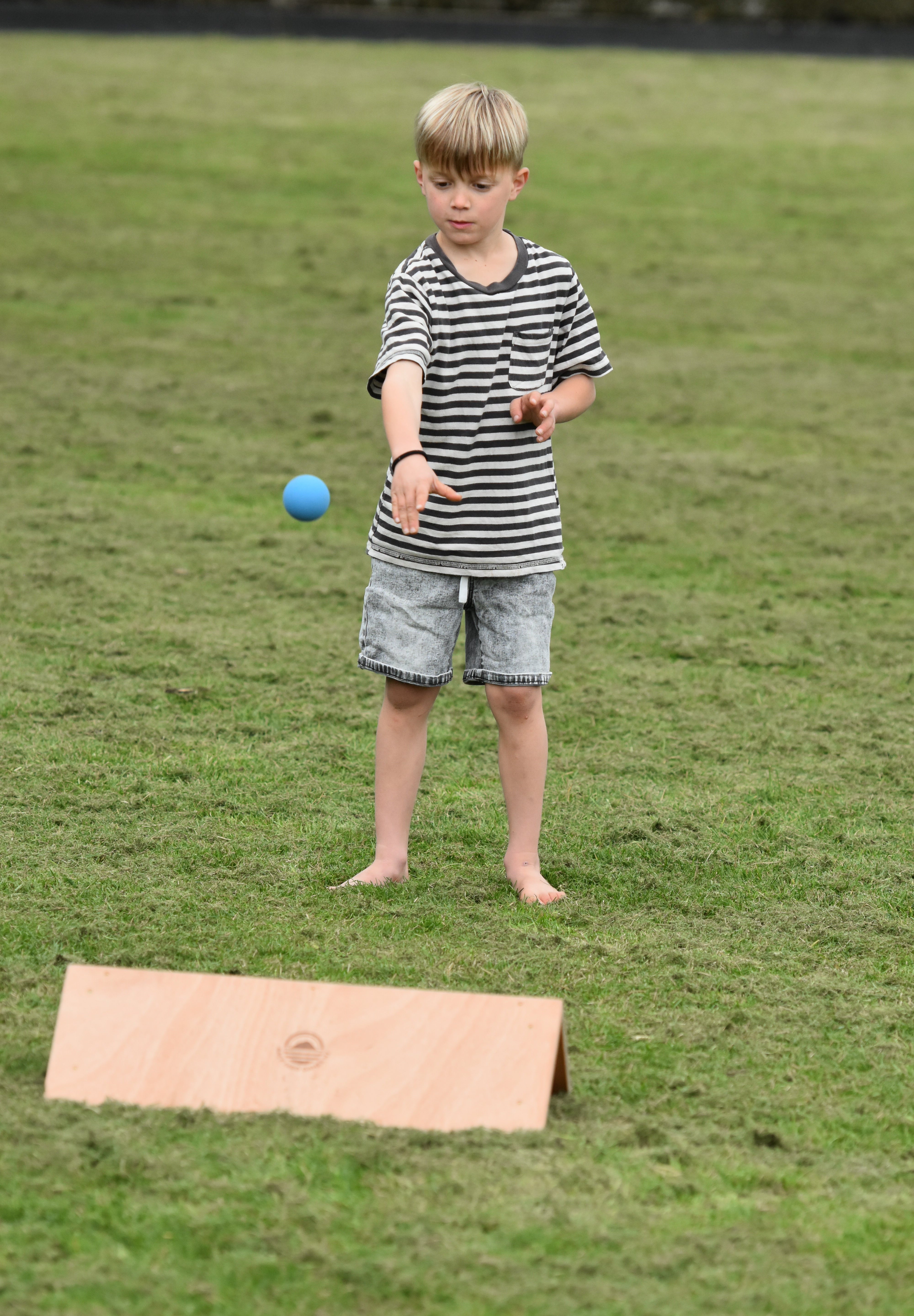 Kis playing outdoor games NZ — Gutter board in the backyard