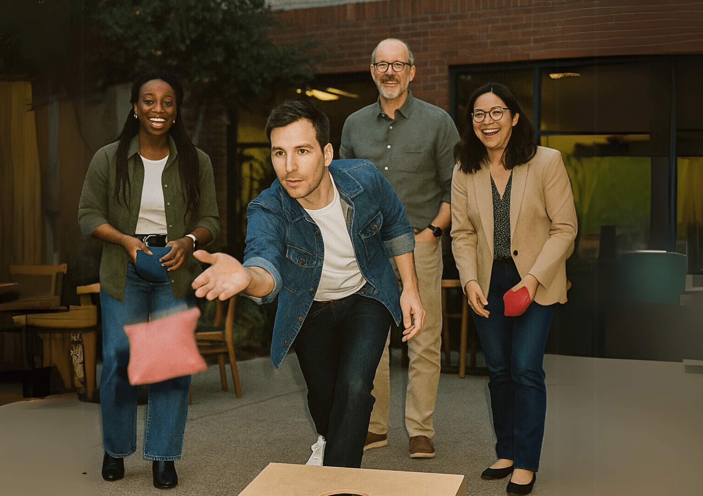 Colleague playing Cornhole in courtyard