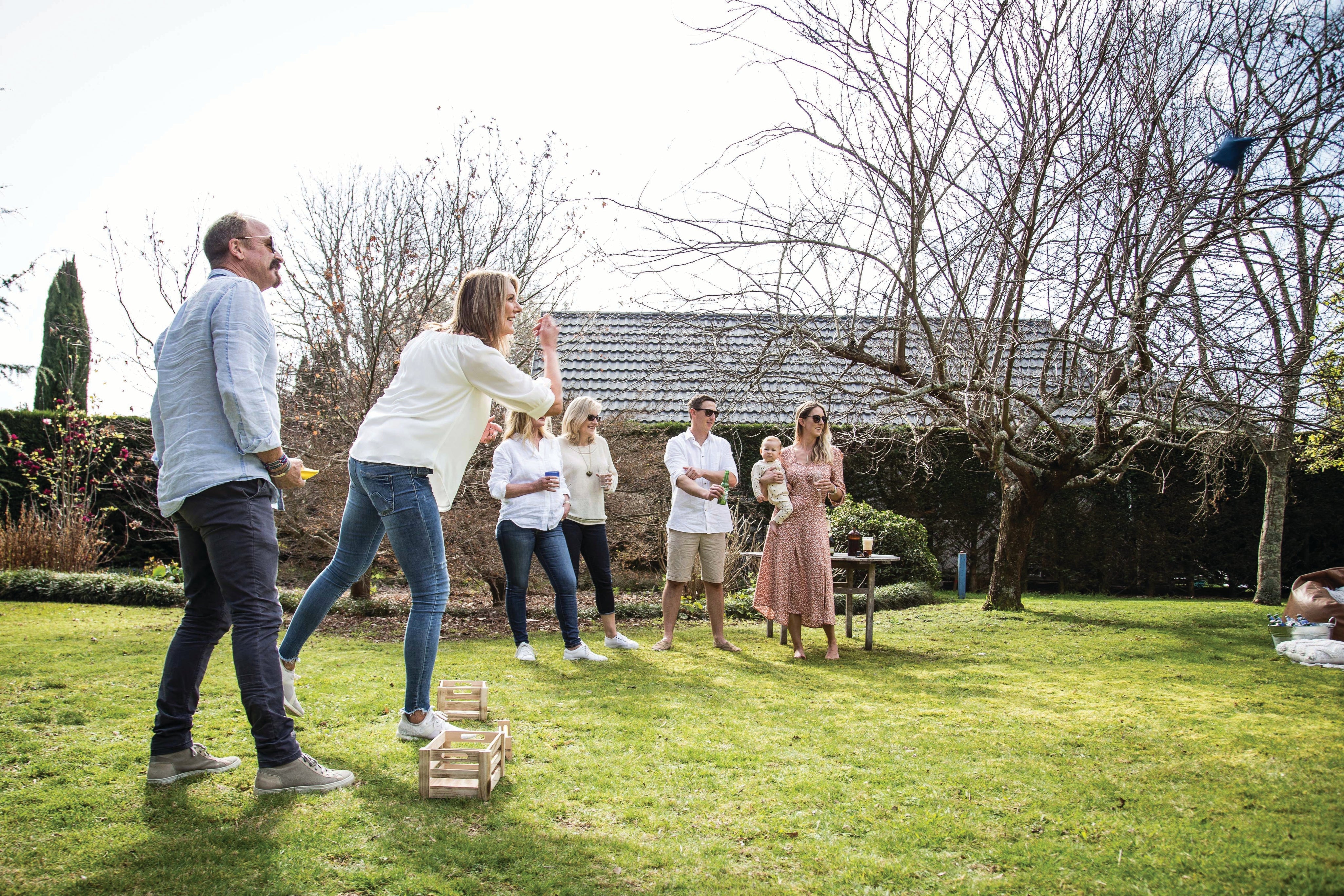 Group playing Backyard Games NZ Cornhole