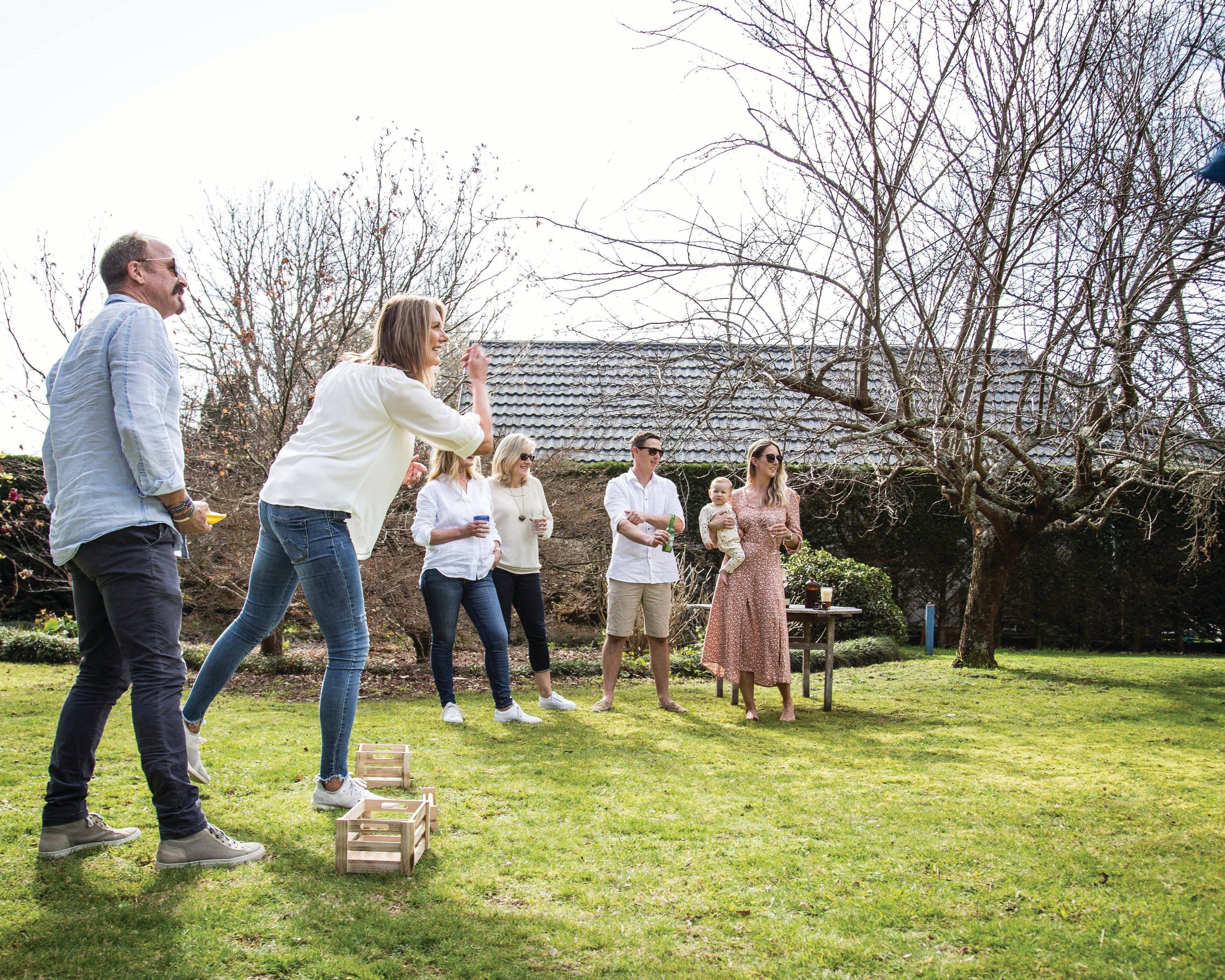 Group playing Backyard Games NZ Cornhole