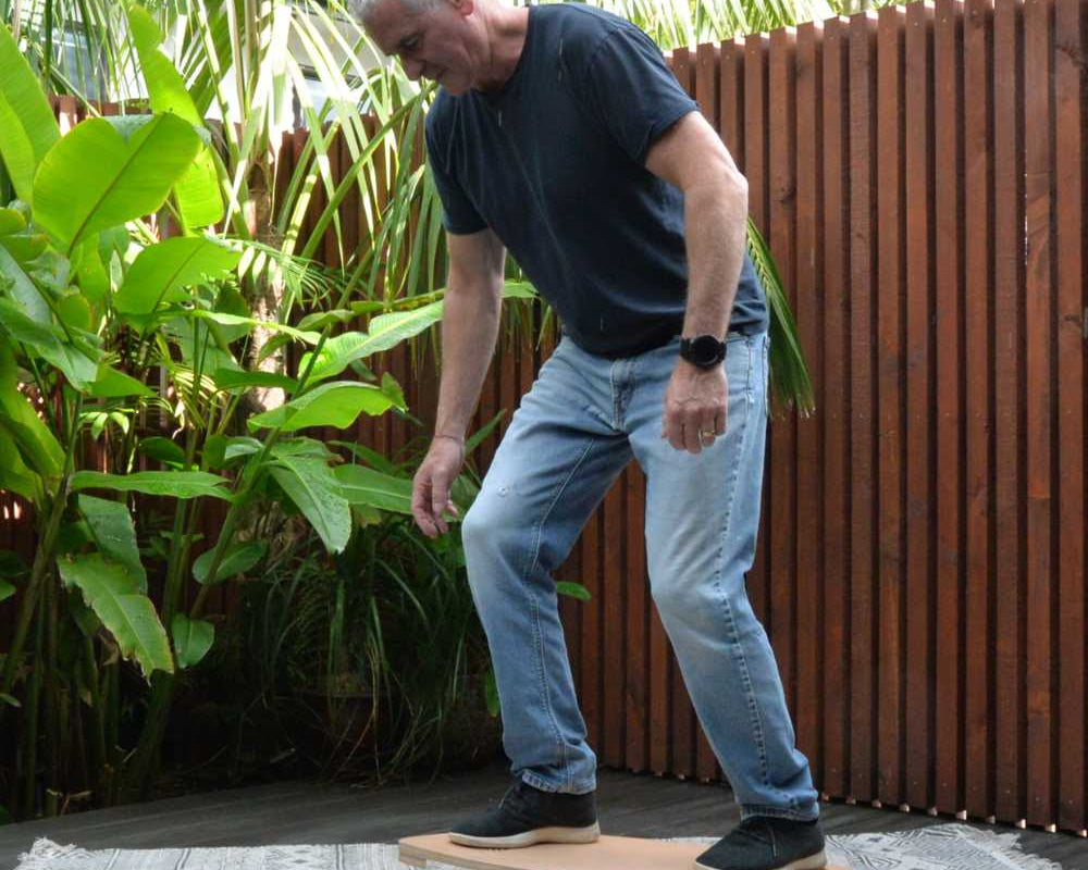 man playing on a balance board