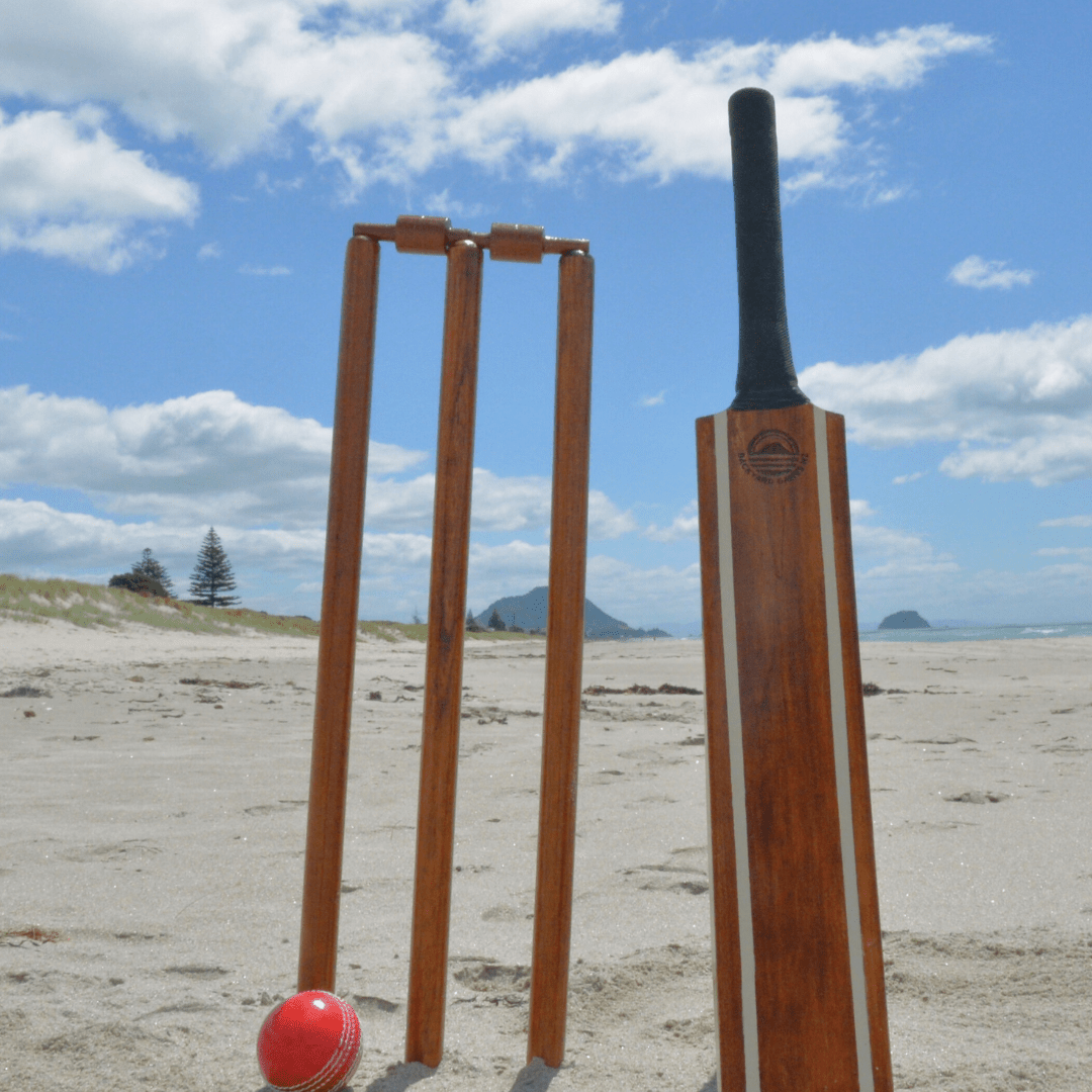 Backyard Cricket Set NZ — wooden bat, wickets, bails and semi-soft ball on the beach