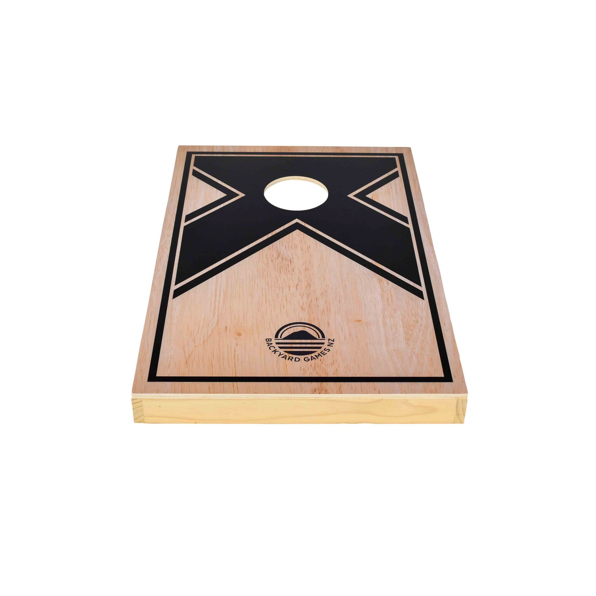 Close-up of black X graphic design on NZ pine and birch plywood cornhole board