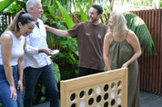 Group of people playing Backyard Games NZ Giant Connect Four outdoors