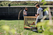 People playing premium outdoor games in a New Zealand backyard.