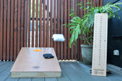 Premium Signature Cornhole board with bag and scoring tower.