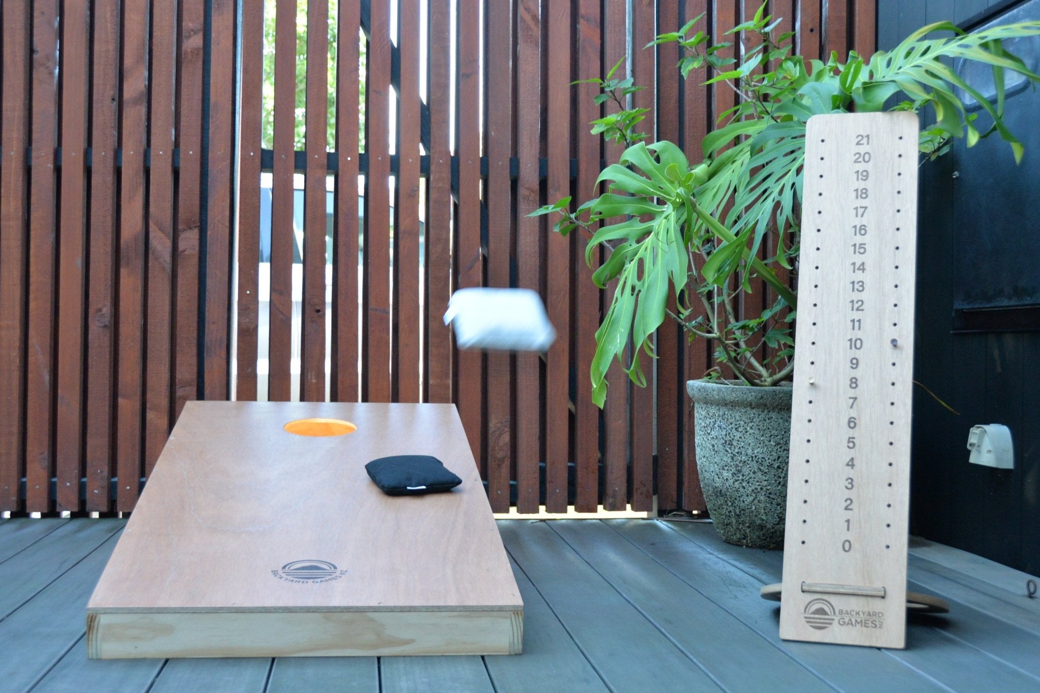 Premium Signature Cornhole board with bag and scoring tower.