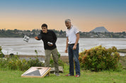 Family playing Cornhole outdoors together in NZ backyard — Backyard Games bundle